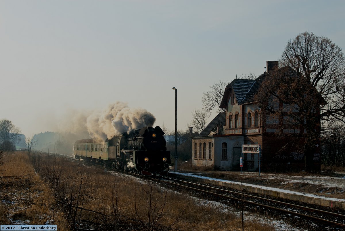 2012-02-08 14.12 Ol49-59 at Ruchocice station with Poznan-bound train.jpg